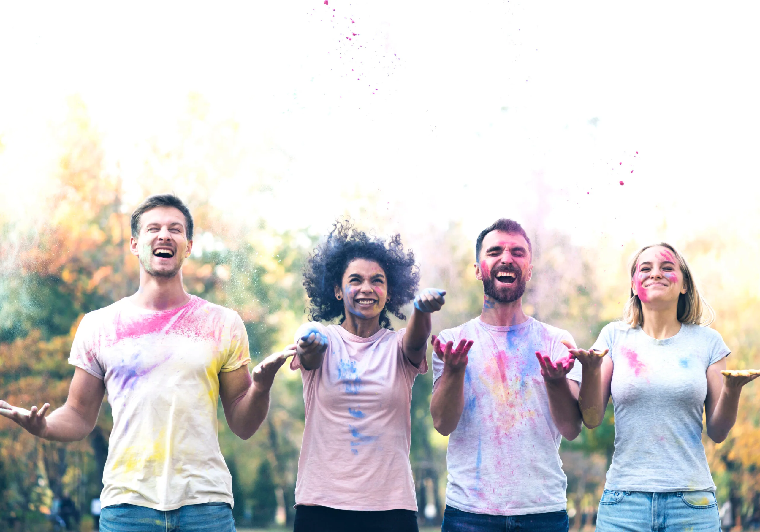 medium-shot-friends-throwing-paint-holi